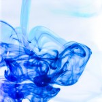Photograph of a plume of blue ink swirling in water